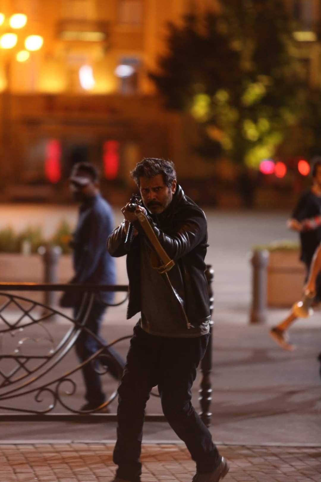 Vikram with Gun Movie Image