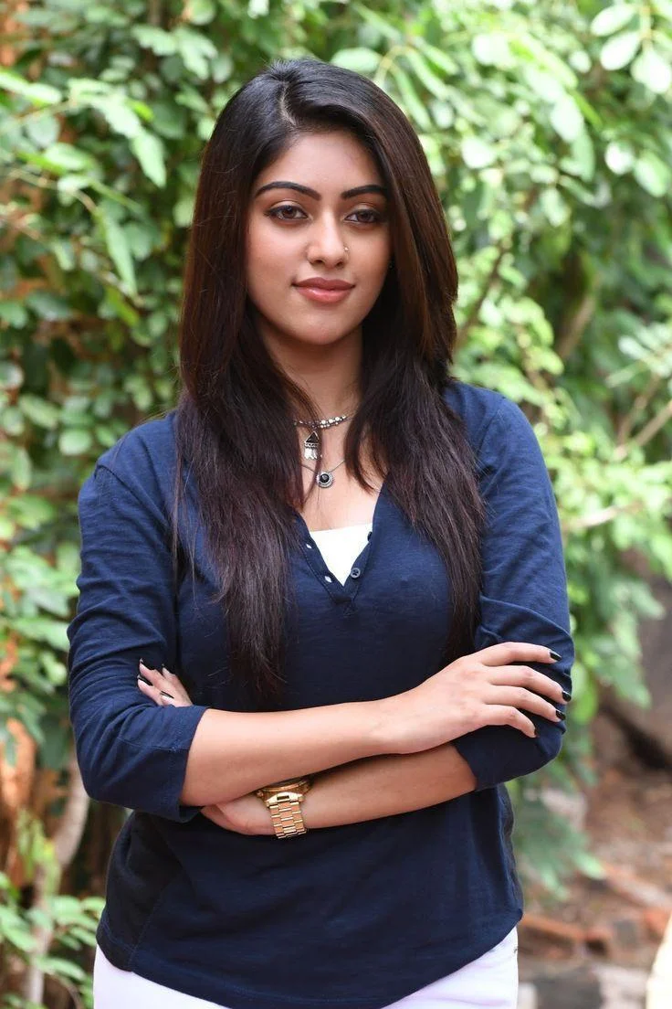 Anu Emmanuel in Blue Top and White Jeans Hd Wallpaper