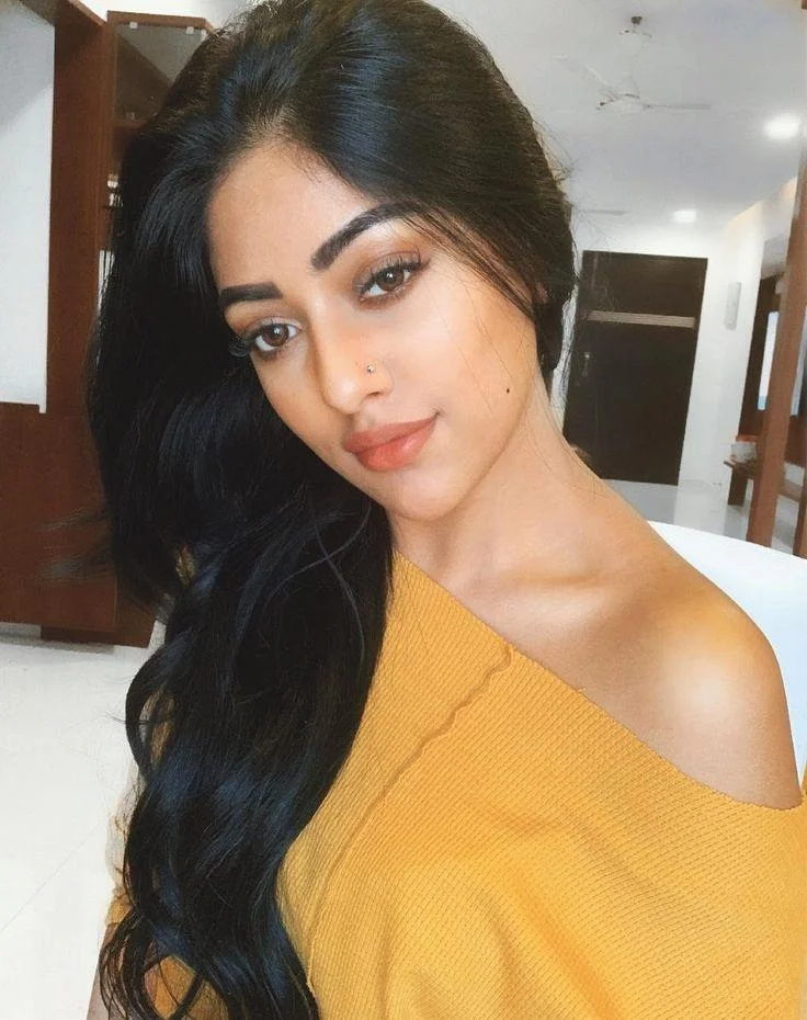 Anu Emmanuel in Bold Orange Outfit Wallpaper