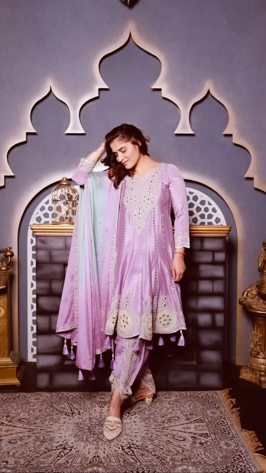 Arti Singh standing confidently in a lavender ethnic set
