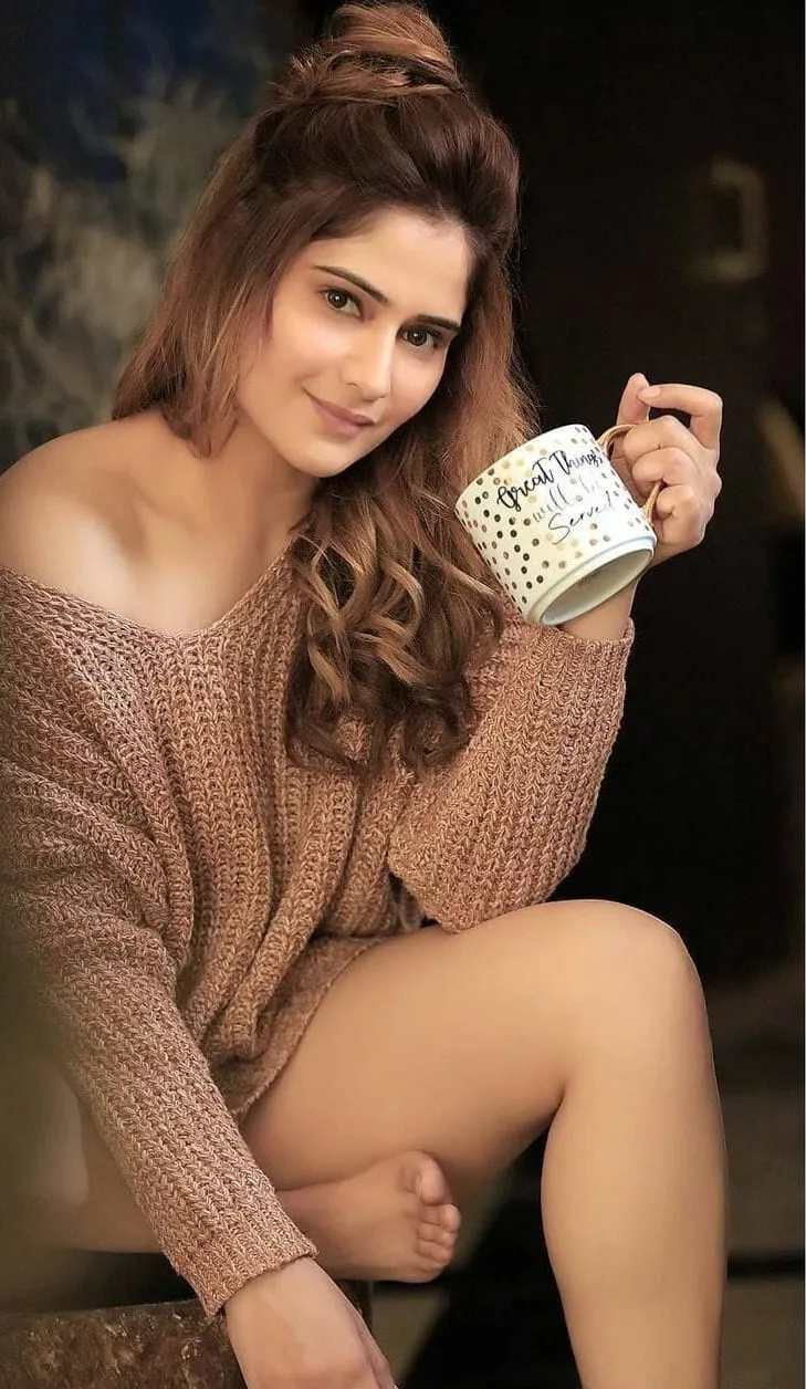 Arti Singh is enjoying a cozy moment with a warm coffee