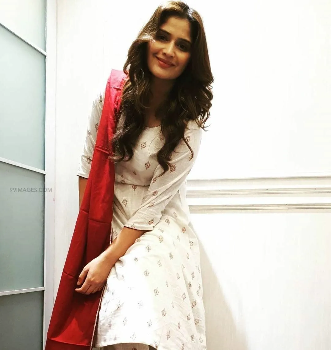 Arti Singh smiling gracefully in a white ethnic outfit image