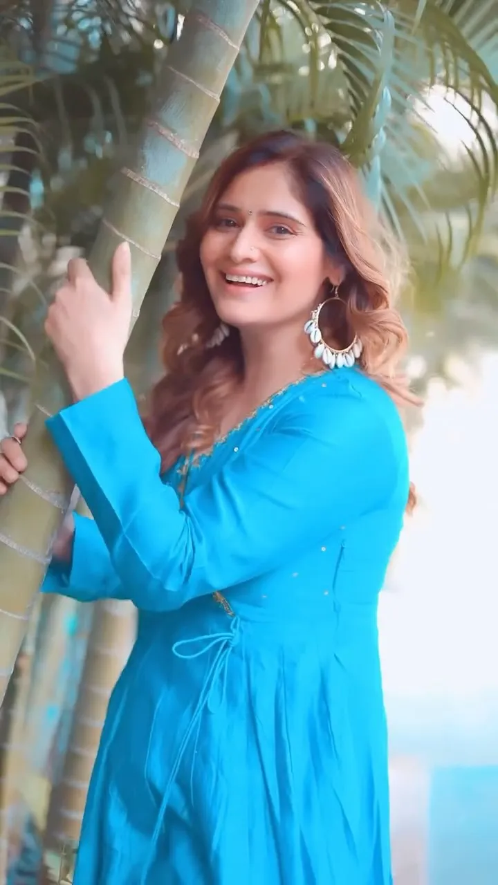 Arti Singh glowing in a bright blue dress under the sun