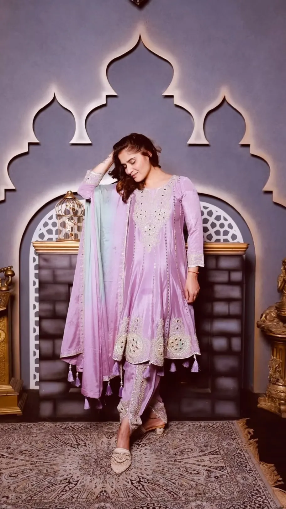 Arti Singh standing confidently in a lavender ethnic set