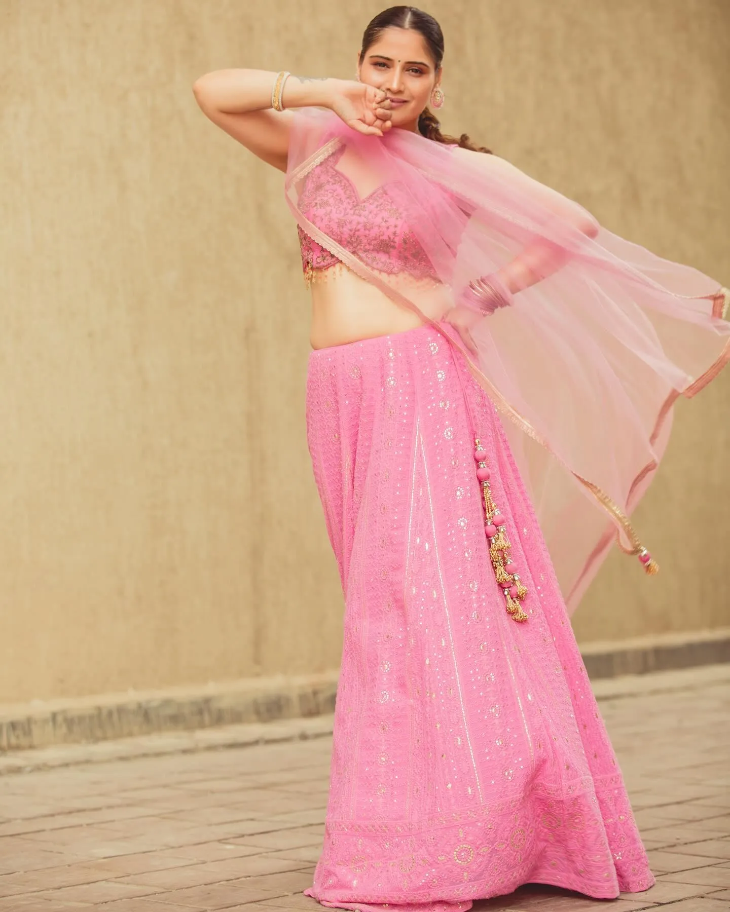 Arti Singh dances gracefully in a bright pink lehenga set