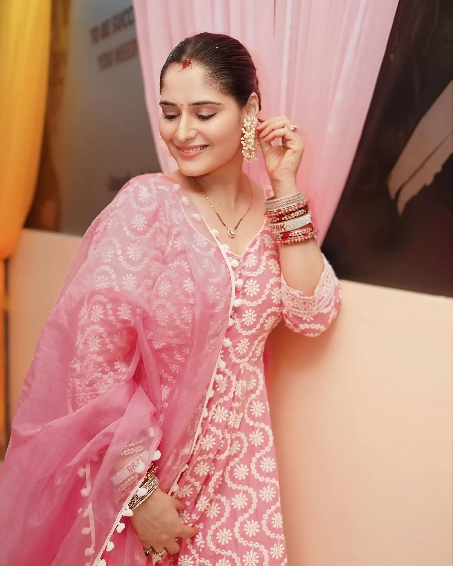 Arti Singh glows in a pink embroidered suit with a smile