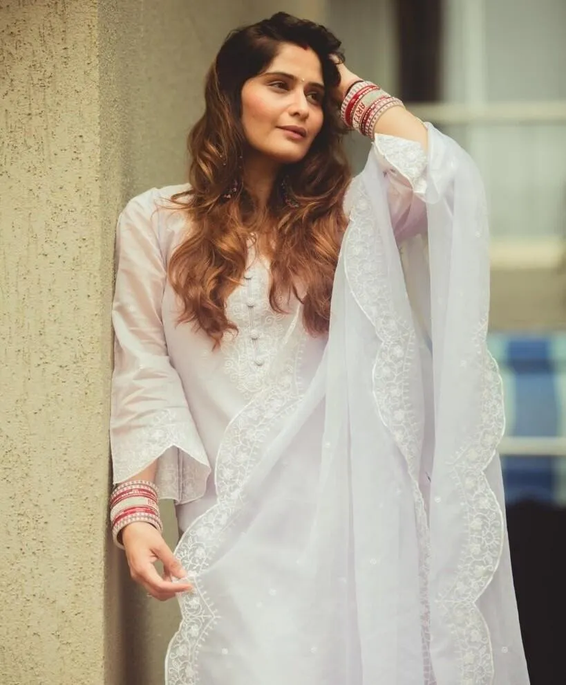 Arti Singh in white traditional outfit with soft expression