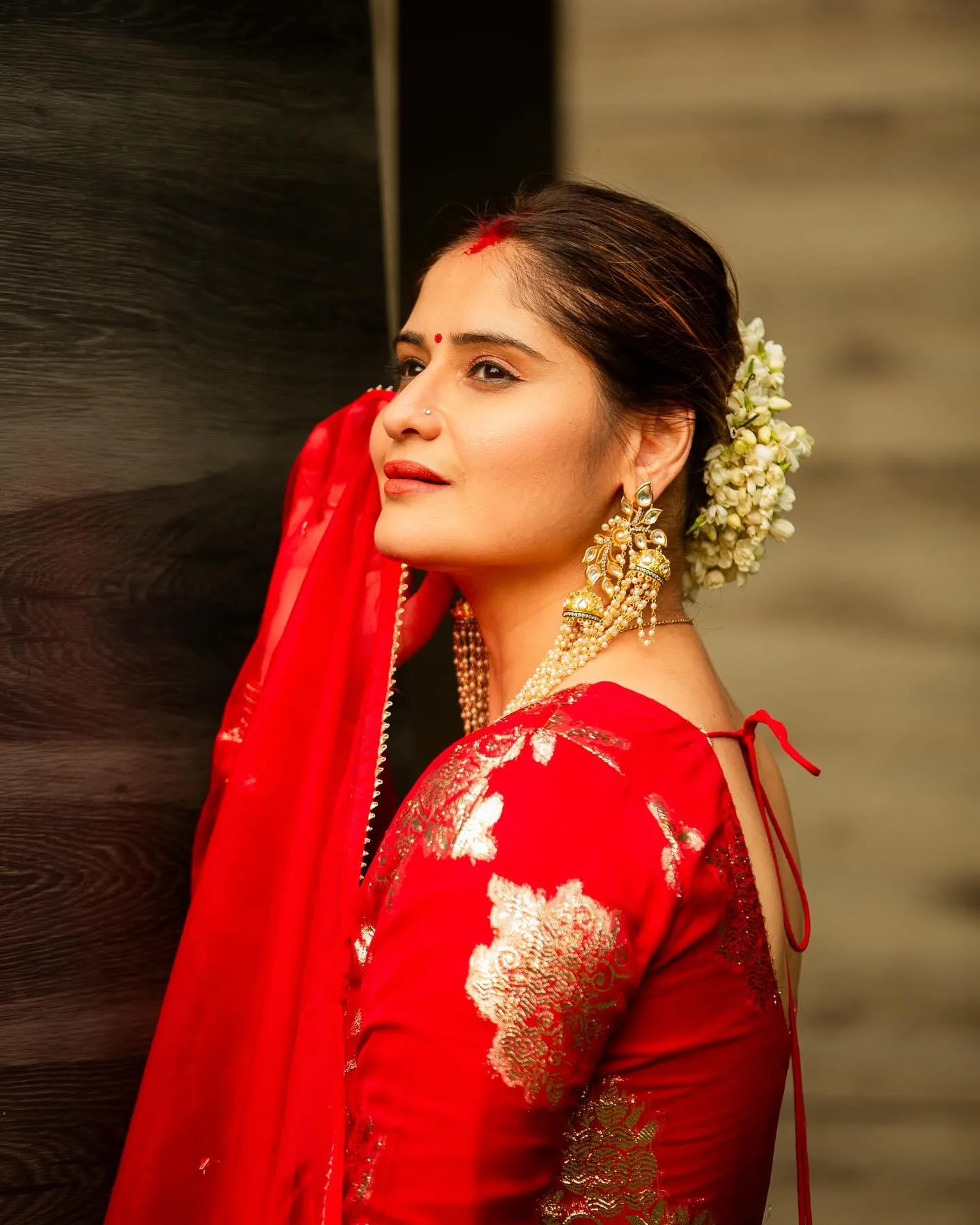 Arti Singh looks divine in a classic red saree and gajra