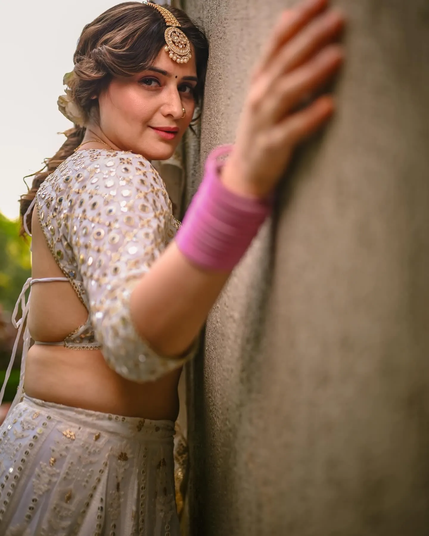 Arti Singh poses in a silver outfit with a confident look
