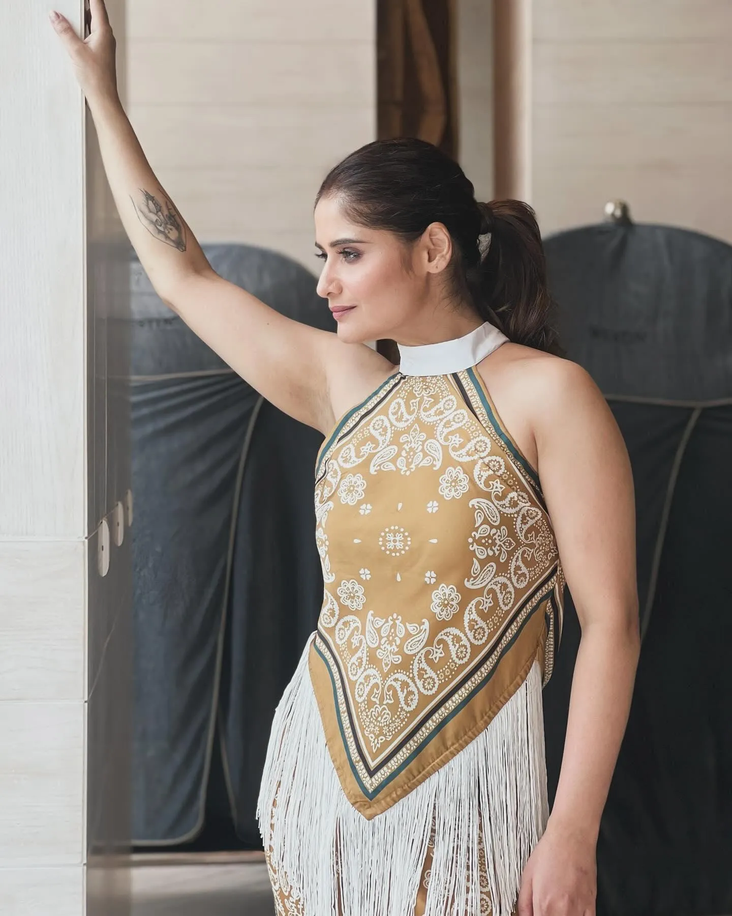 Arti Singh raises her hand in a trendy printed top and skirt