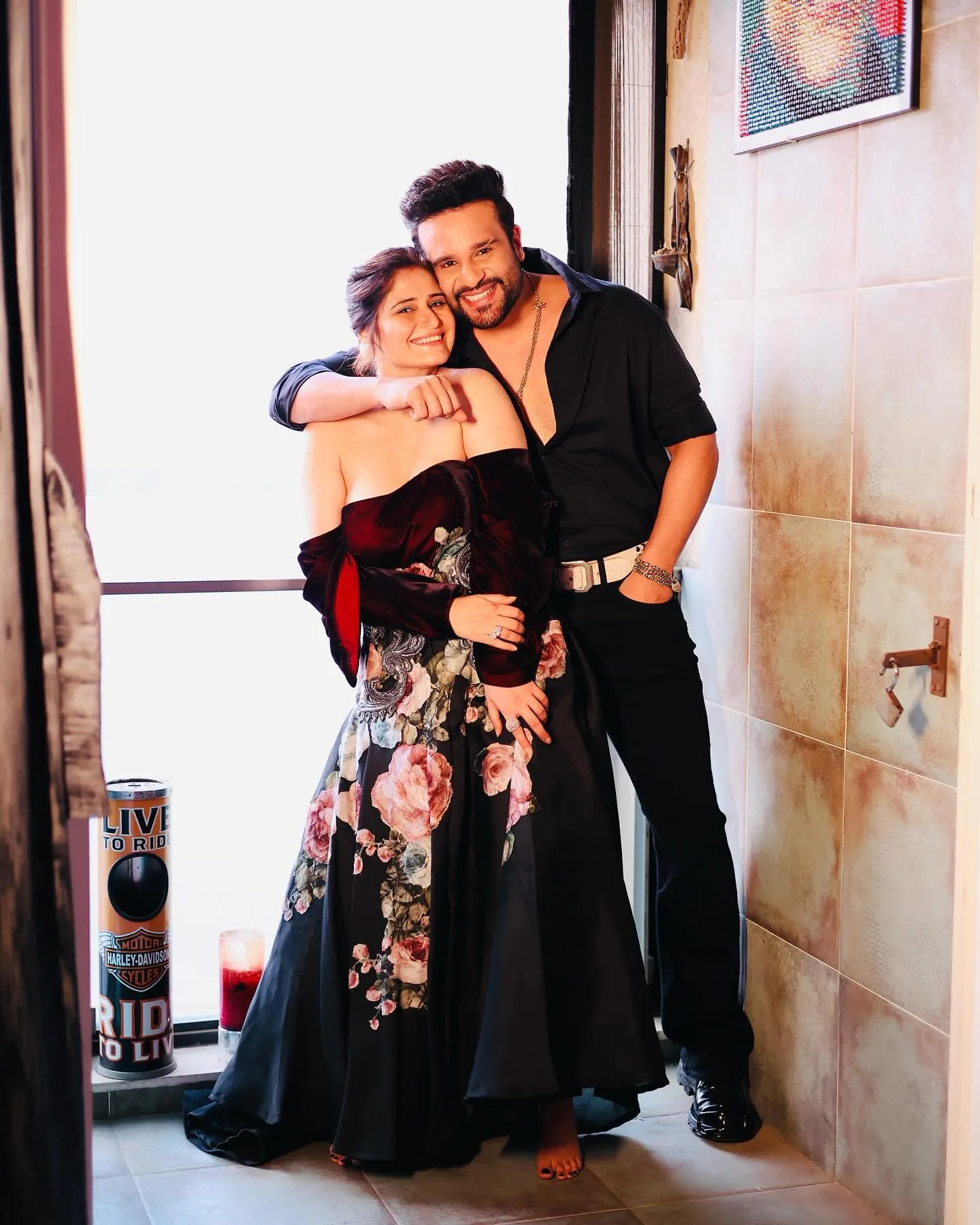 Arti Singh smiling with a friend in a happy indoor moment