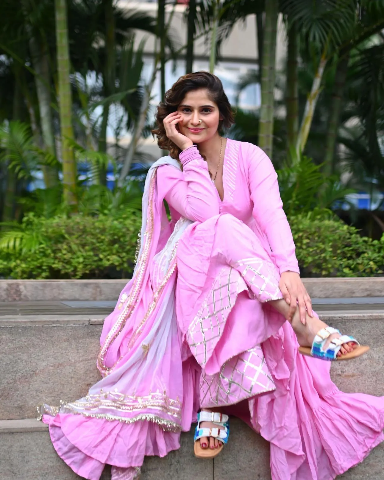 Arti Singh twirls joyfully in a soft pink layered outfit