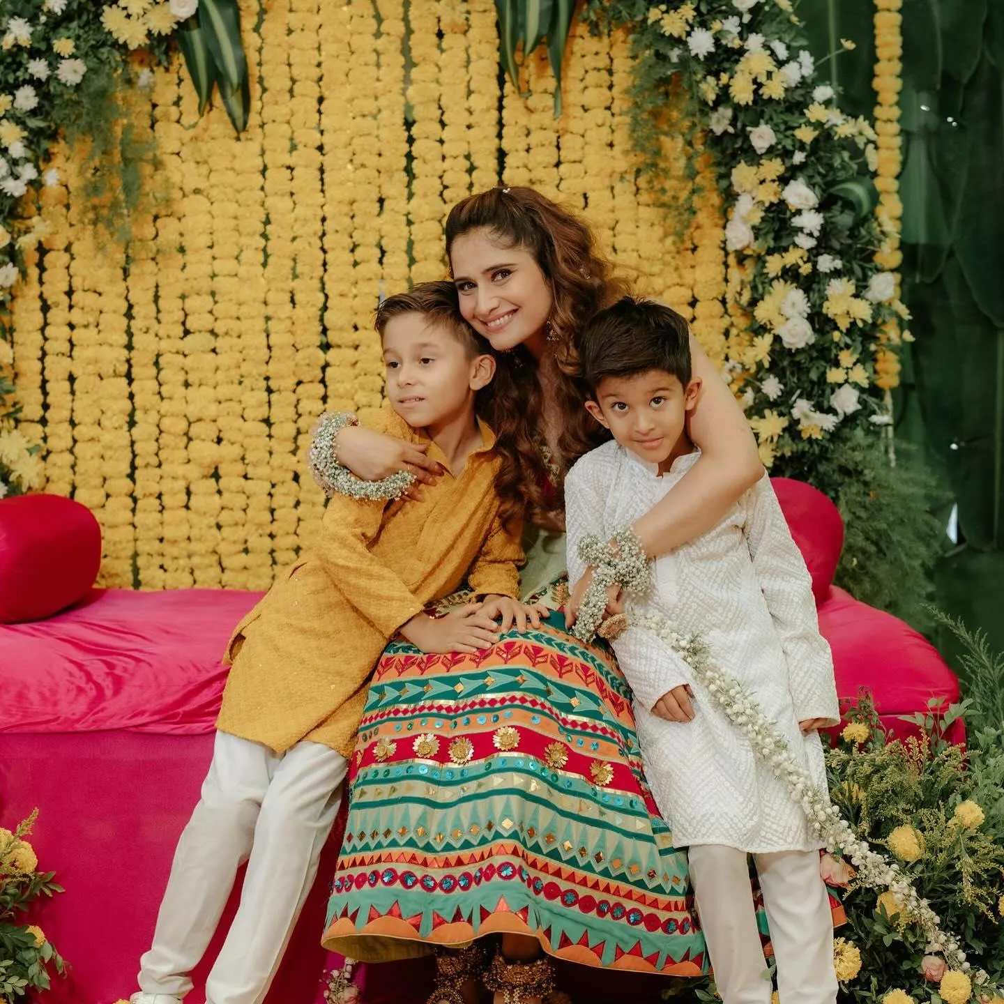 Arti Singh with children in colorful traditional clothes