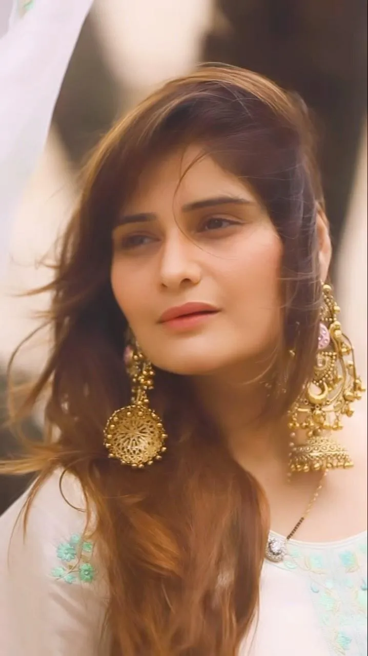 Close up portrait of Arti Singh with golden earrings image
