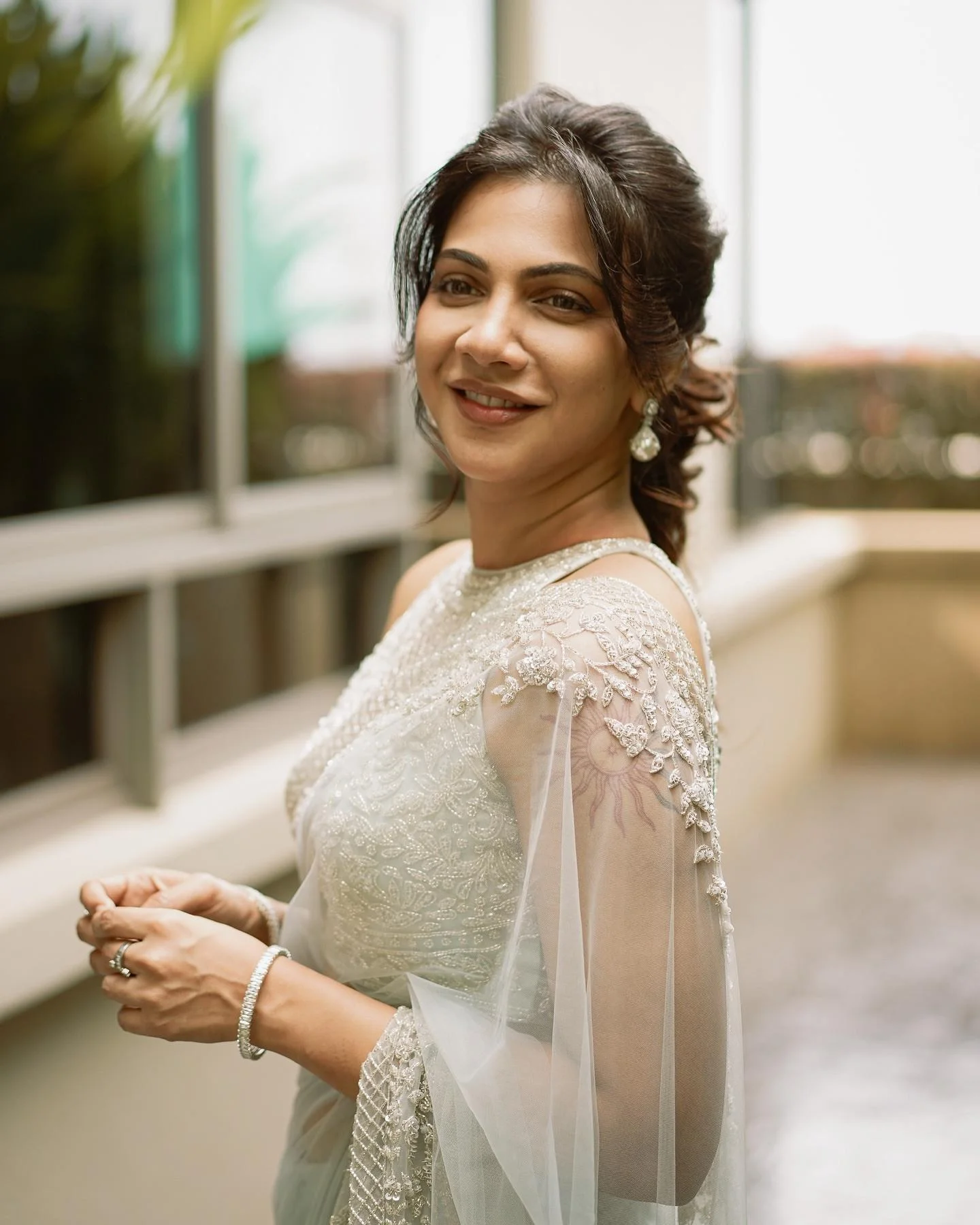 Madonna Sebastian cute in White Saree Hd Portrait