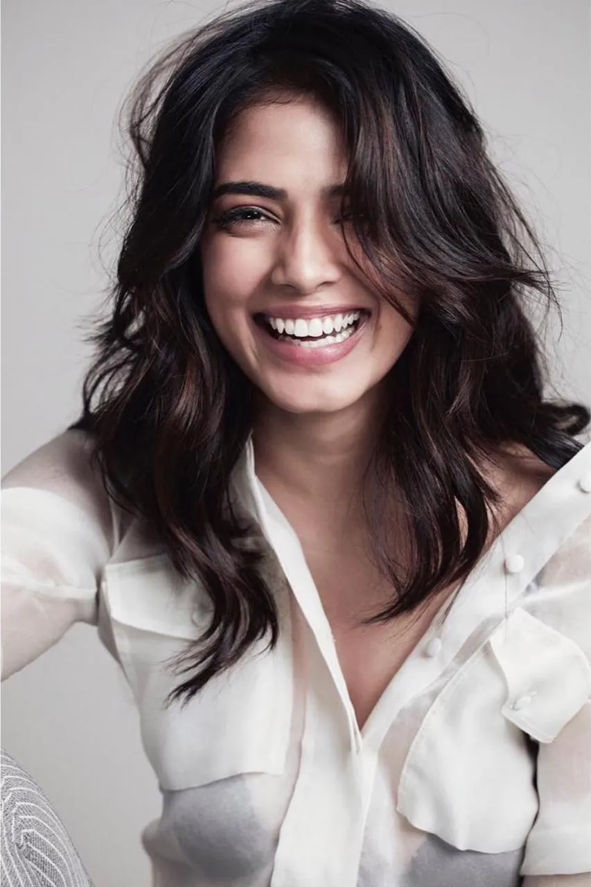Attractive Malavika Mohanan Beautiful White Dress Smile