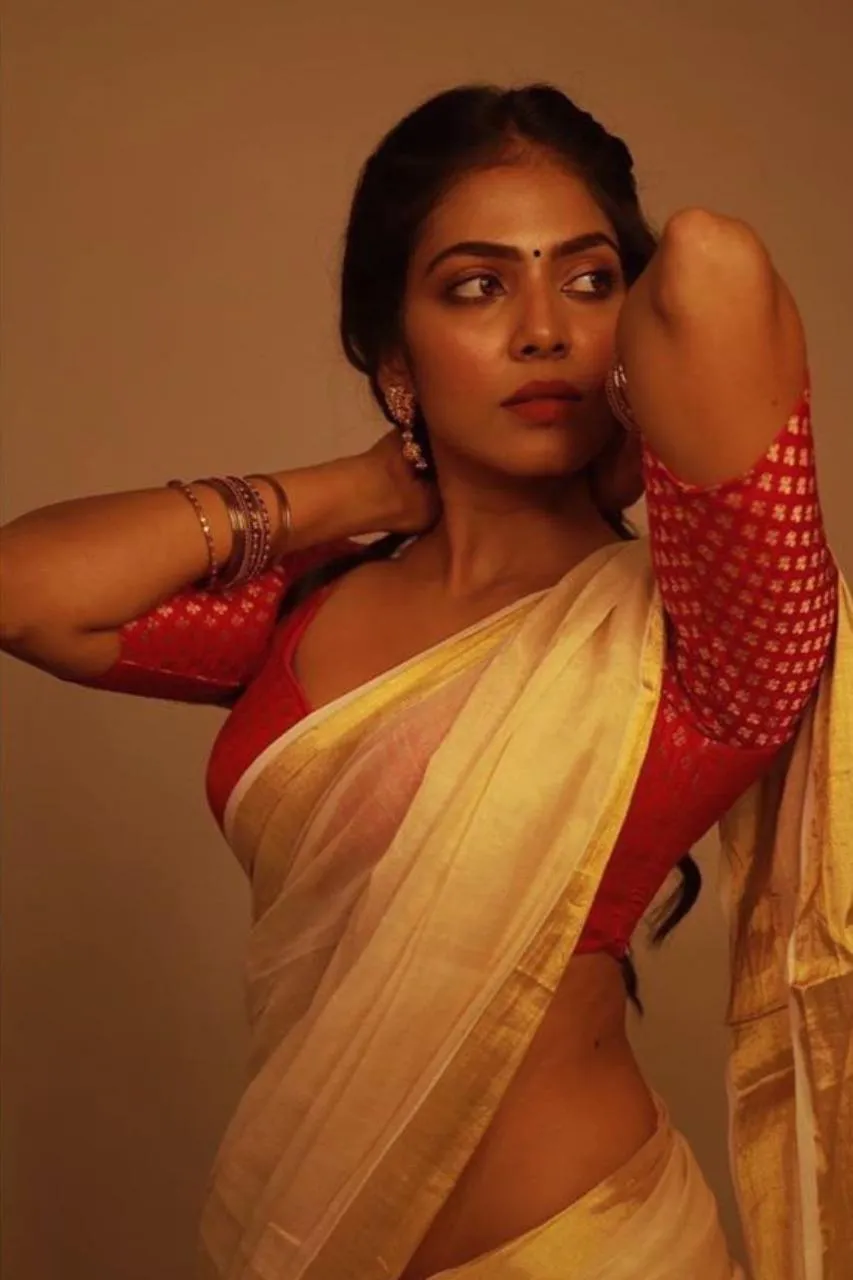 Attractive Malavika Mohanan Elegant Orange Saree Portrait