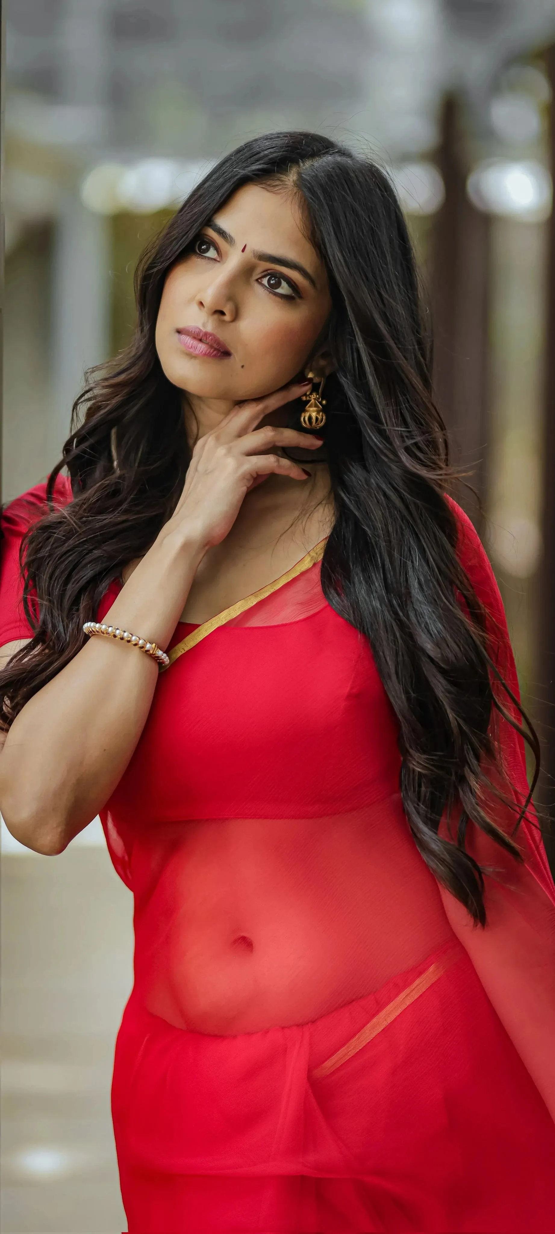 Attractive Malavika Mohanan in a Stunning Red Dress Pose