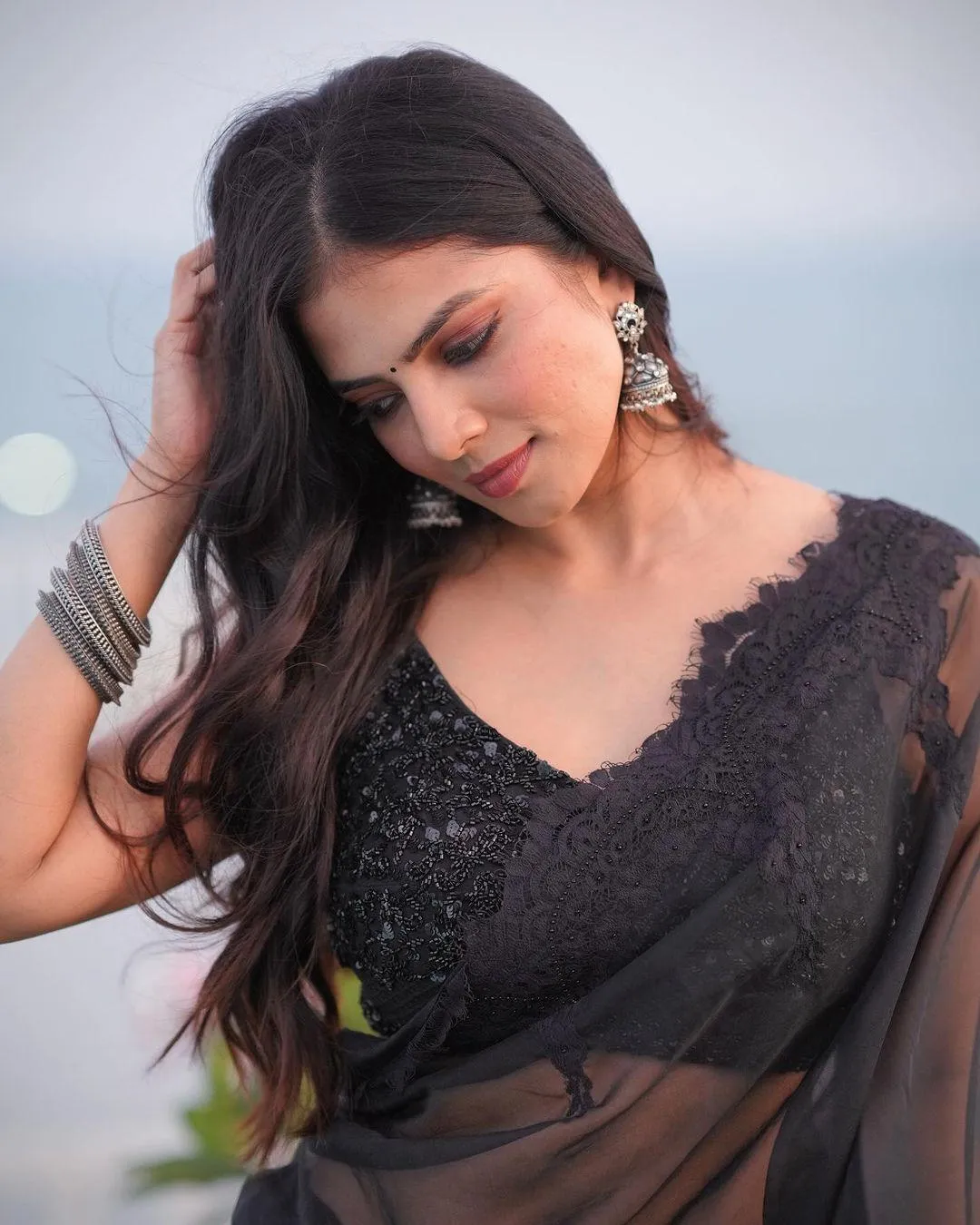 Attractive Malavika Mohanan in Black Blouse Soft Side Pose