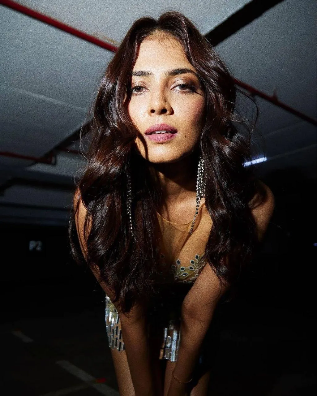 Attractive Malavika Mohanan in Black Top Bold Indoor Pose