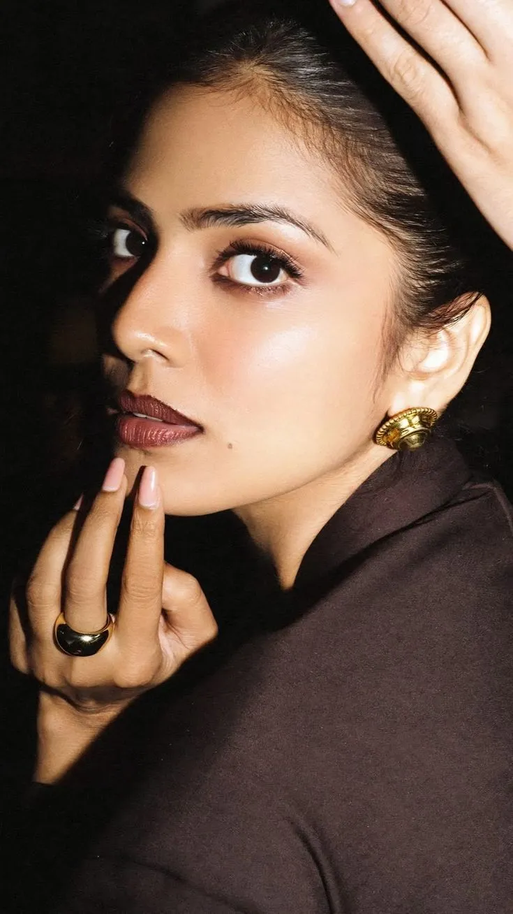Attractive Malavika Mohanan in Brown Dress Classic Pose