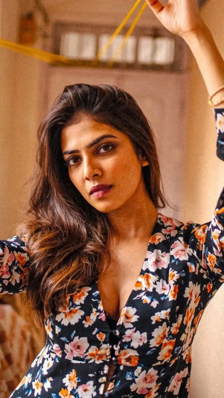 Attractive Malavika Mohanan in Floral Dress Charming Pose