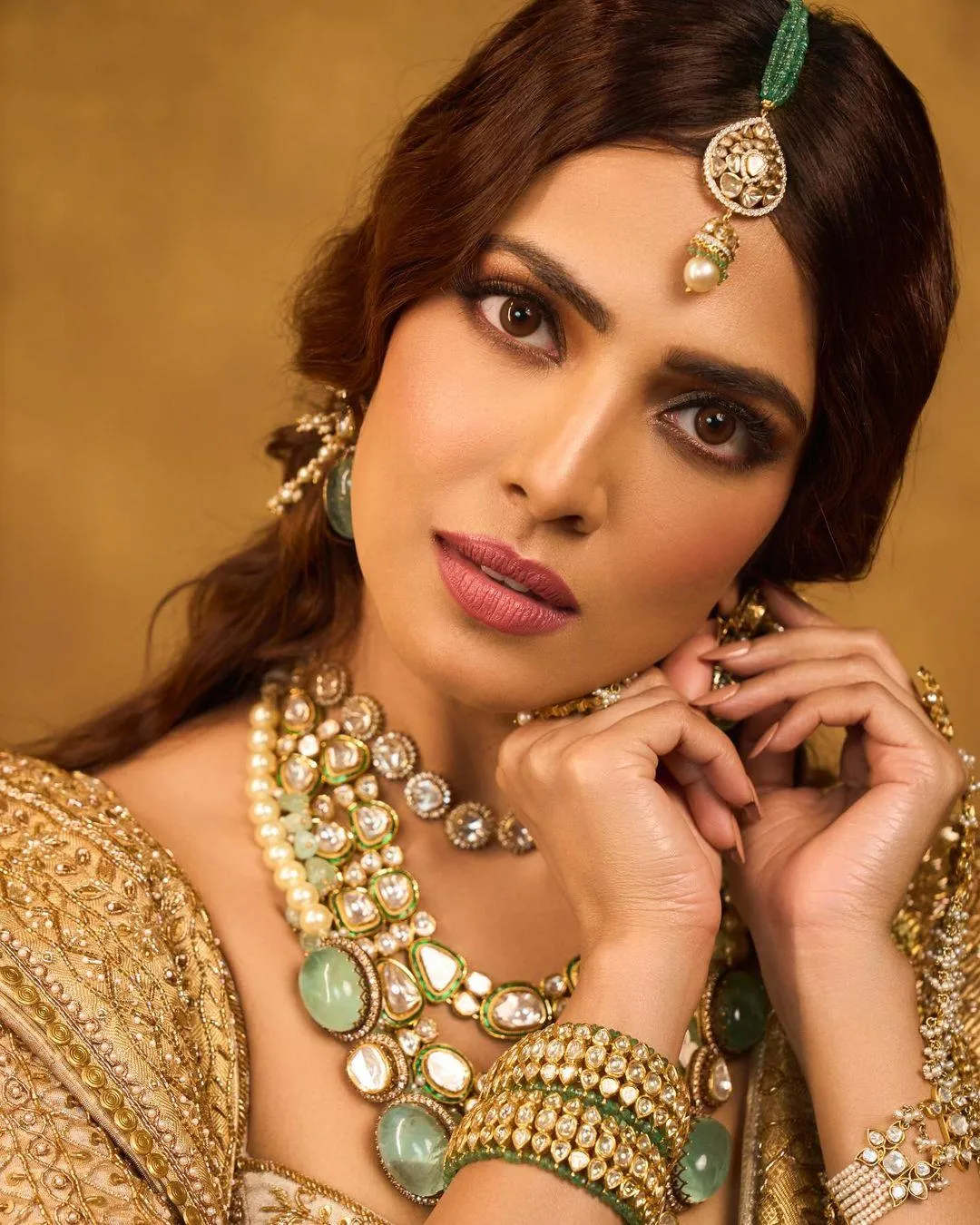Attractive Malavika Mohanan in Golden Blouse Close Pose