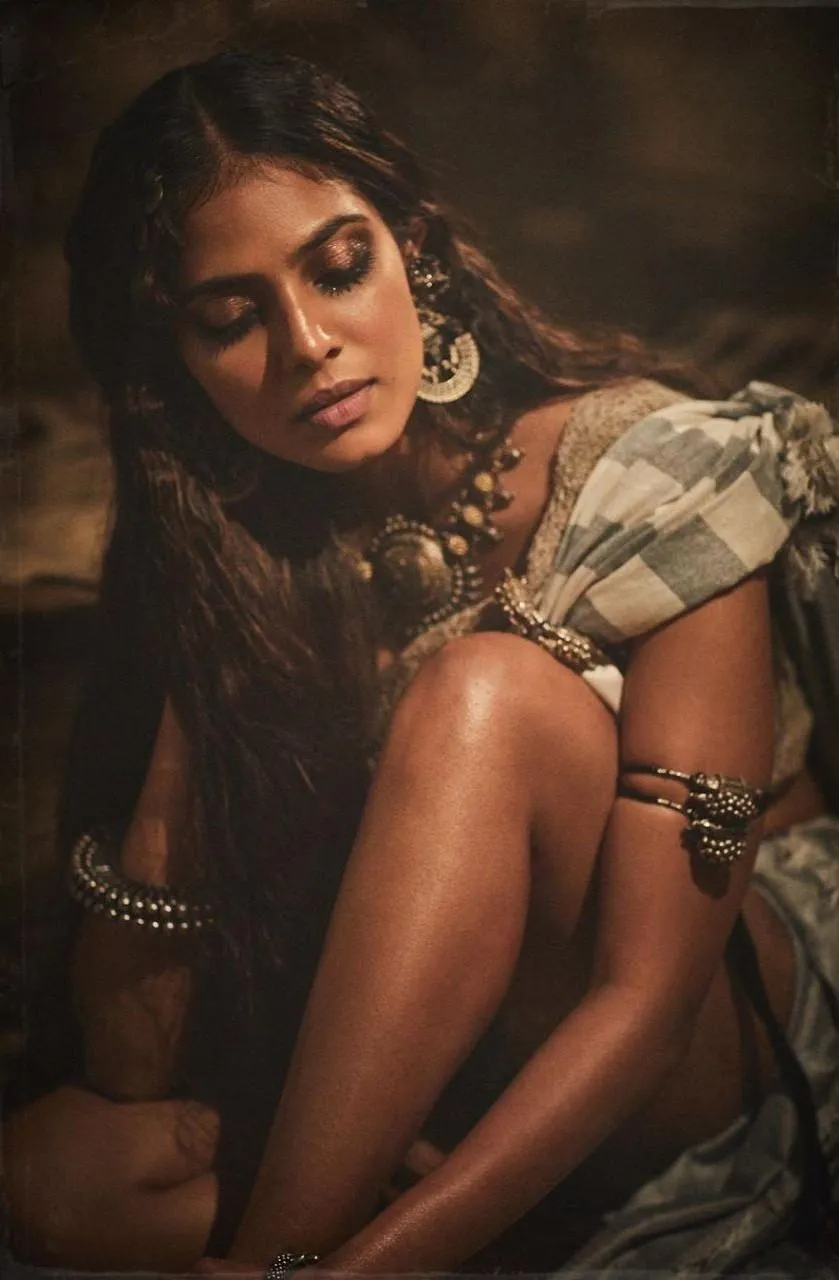 Attractive Malavika Mohanan in Golden Ethnic Sitting Pose