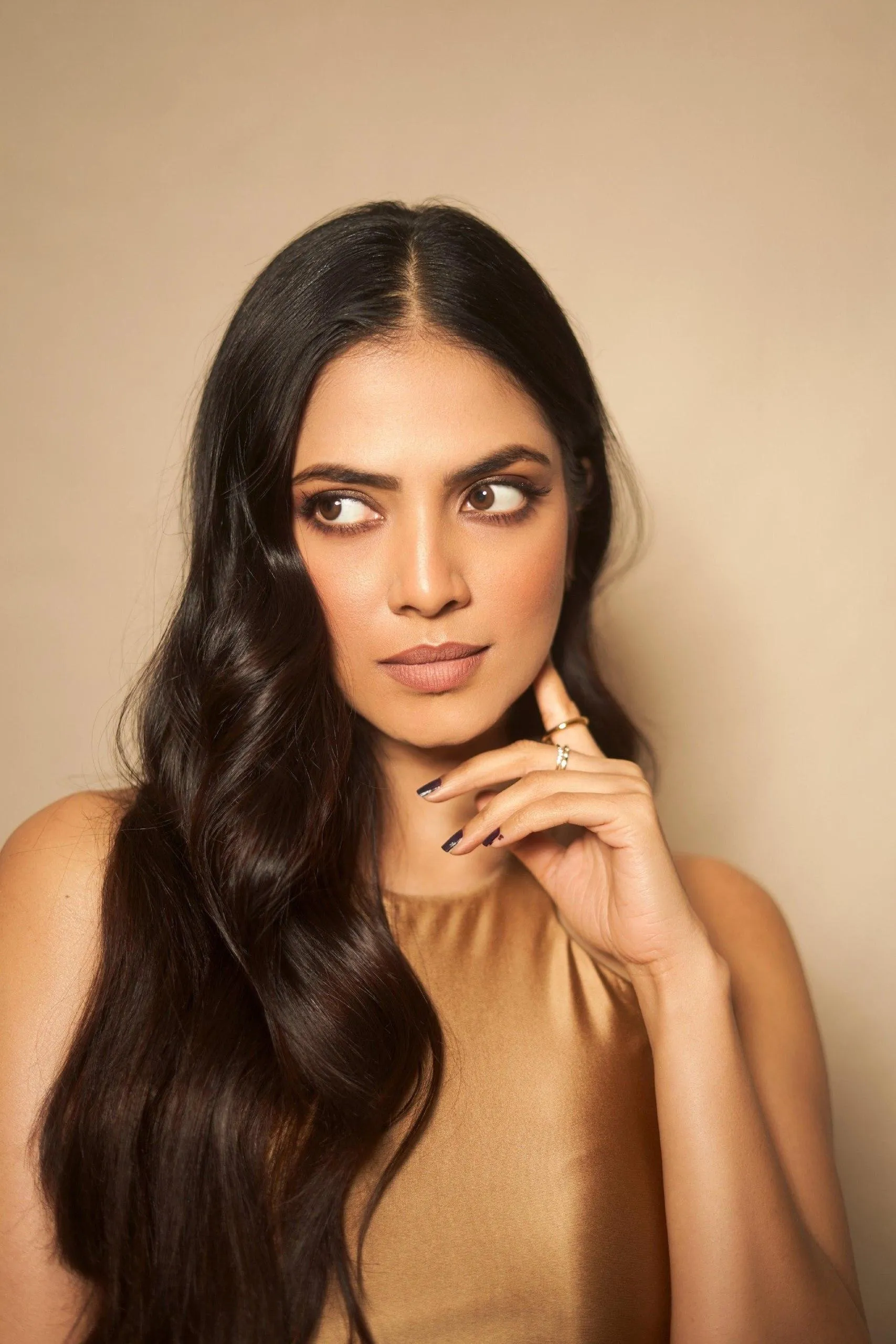 Attractive Malavika Mohanan in Golden Outfit Closeup Pose