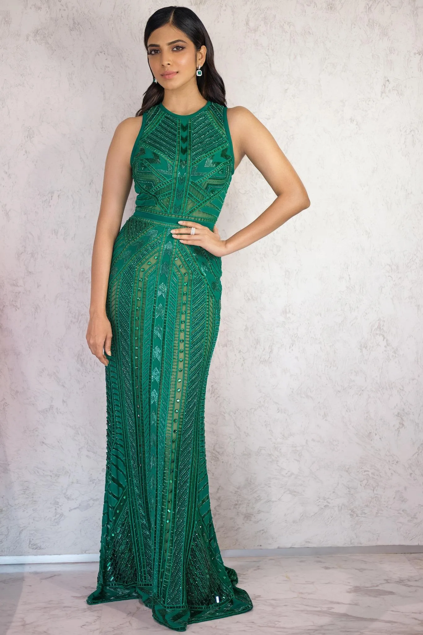 Attractive Malavika Mohanan in Green Gown Modern Chic Pose