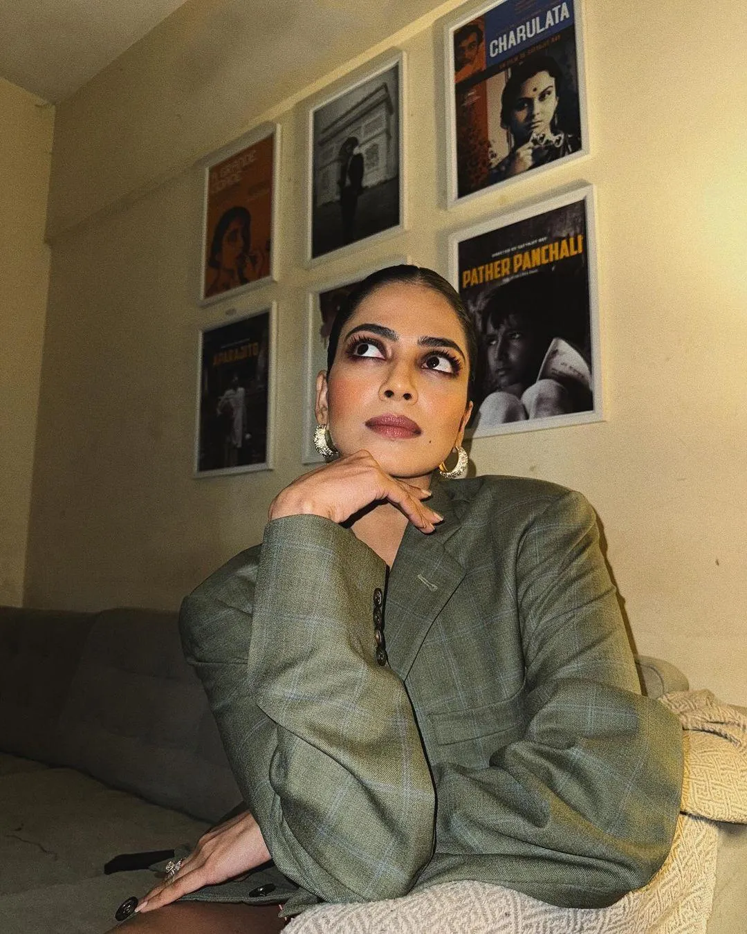 Attractive Malavika Mohanan in Grey Shirt Resting on Hand