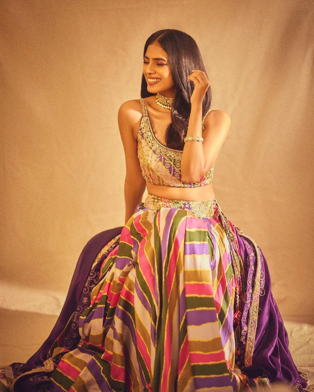 Attractive Malavika Mohanan in Multi Color Gown Elegance