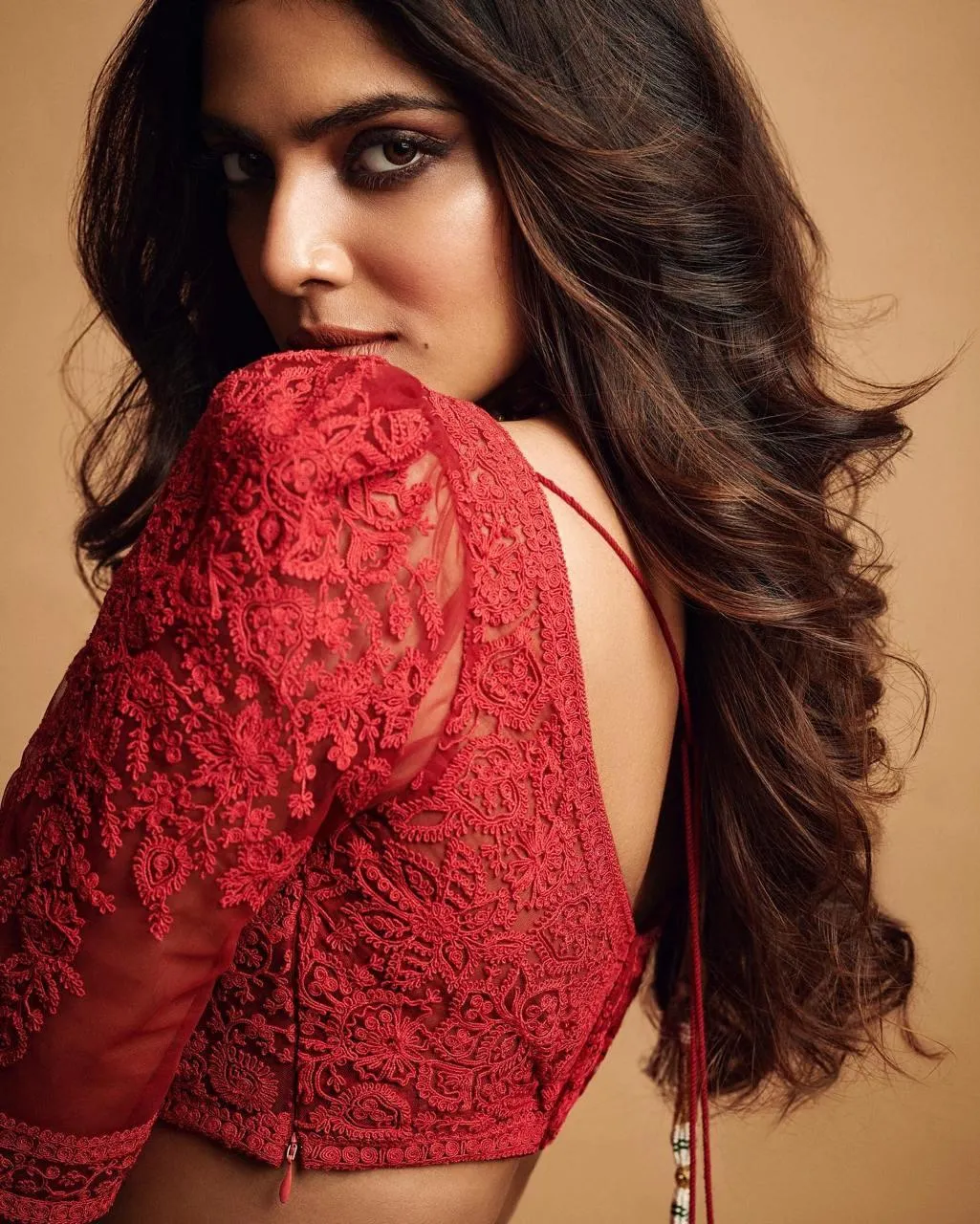 Attractive Malavika Mohanan in Red Gown with Back Pose