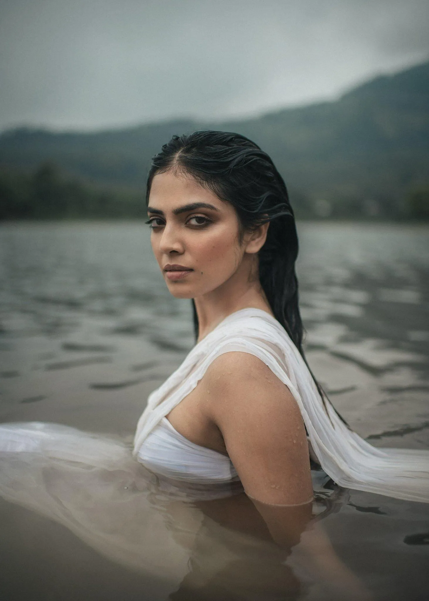 Attractive Malavika Mohanan in White Dress by Seaside Image
