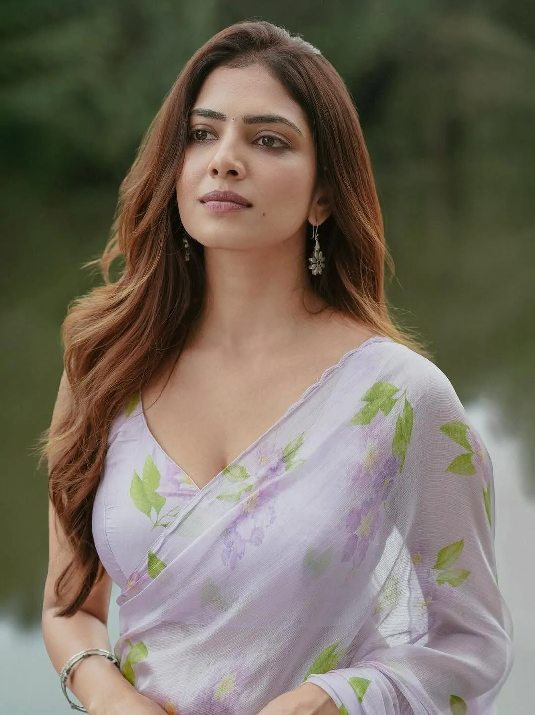 Attractive Malavika Mohanan in White Saree Graceful Photo