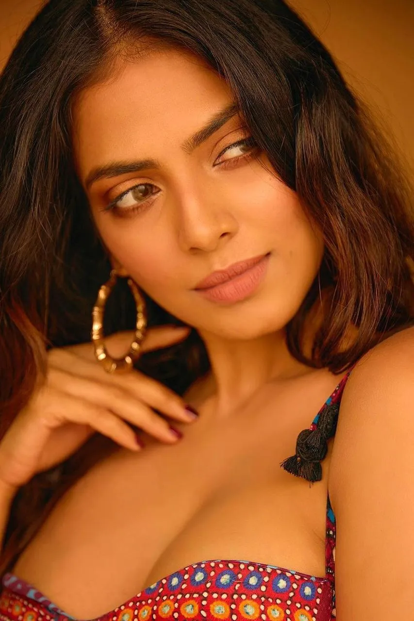 Attractive Malavika Mohanan Posing Wearing Colorful Dress