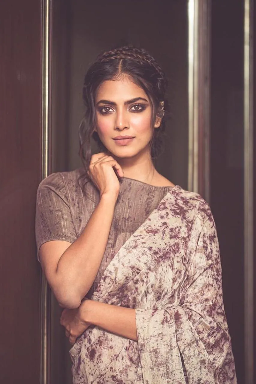 Attractive Malavika Mohanan Wearing Soft Patterned Dress