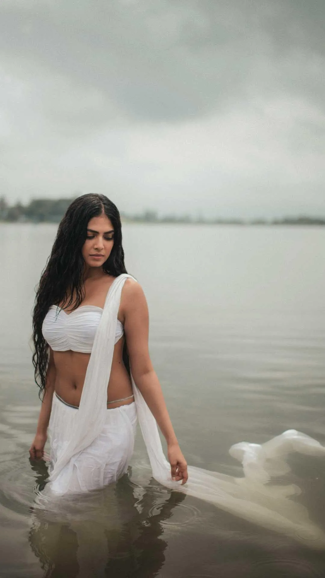 Beautiful Click of Malavika Mohanan Chic Pose in White Gown