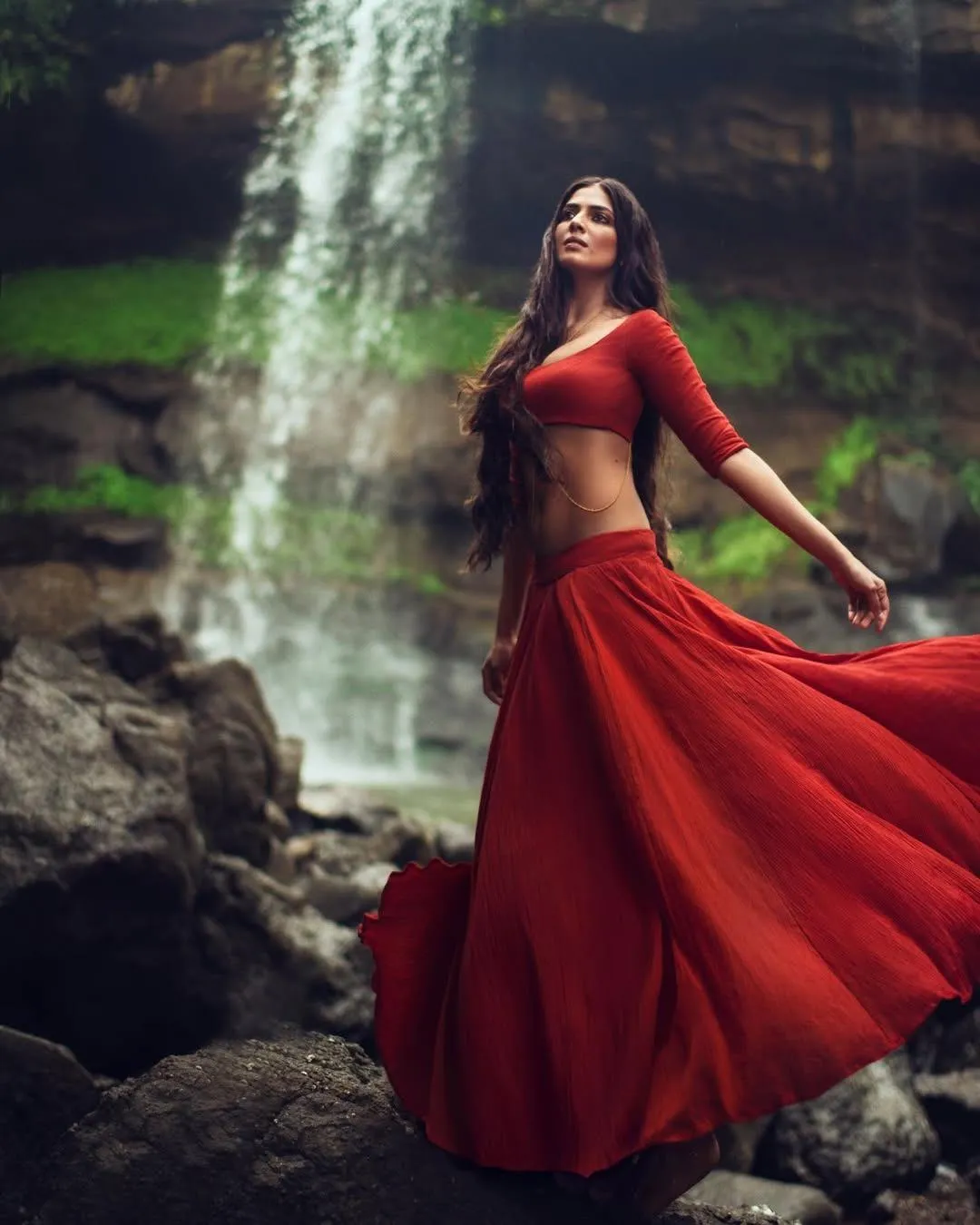 Beautiful Image of Malavika Mohanan Red Gown Near Waterfall