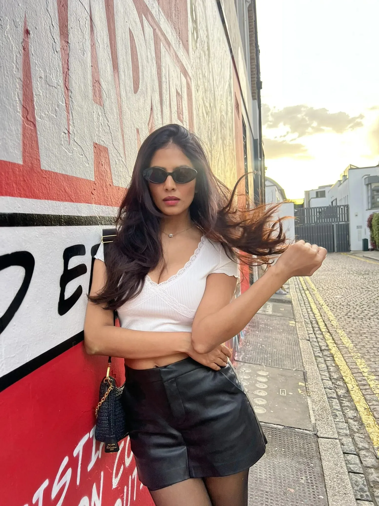 Beautiful Malavika Mohanan in Casual Style by the Wall Image