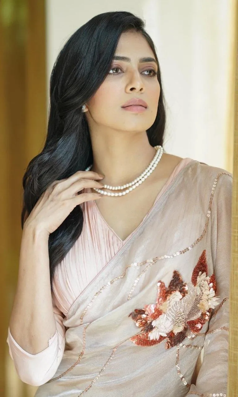 Beautiful Malavika Mohanan in Cream Dress Side Pose Look