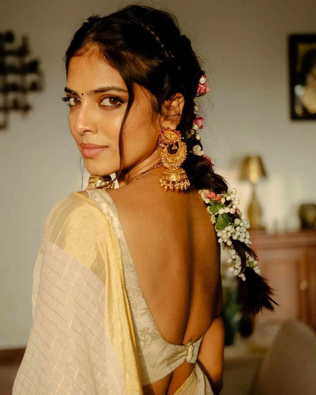 Beautiful Malavika Mohanan in Cream Saree with Side Glance