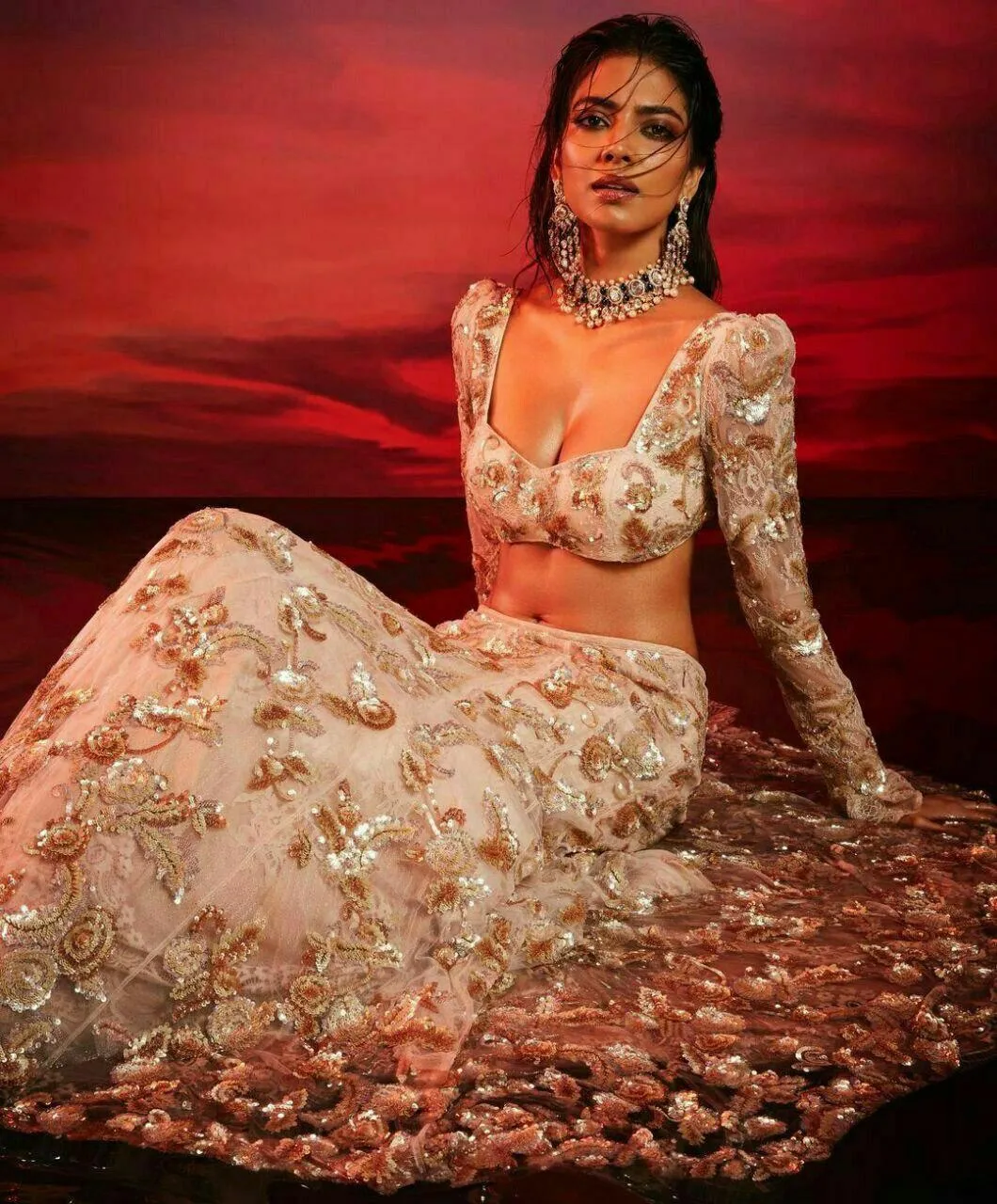 Beautiful Malavika Mohanan in Floral Lehenga Red Background