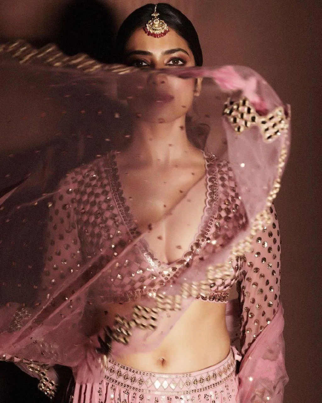 Beautiful Malavika Mohanan in Pink Lehenga Netted Dupatta