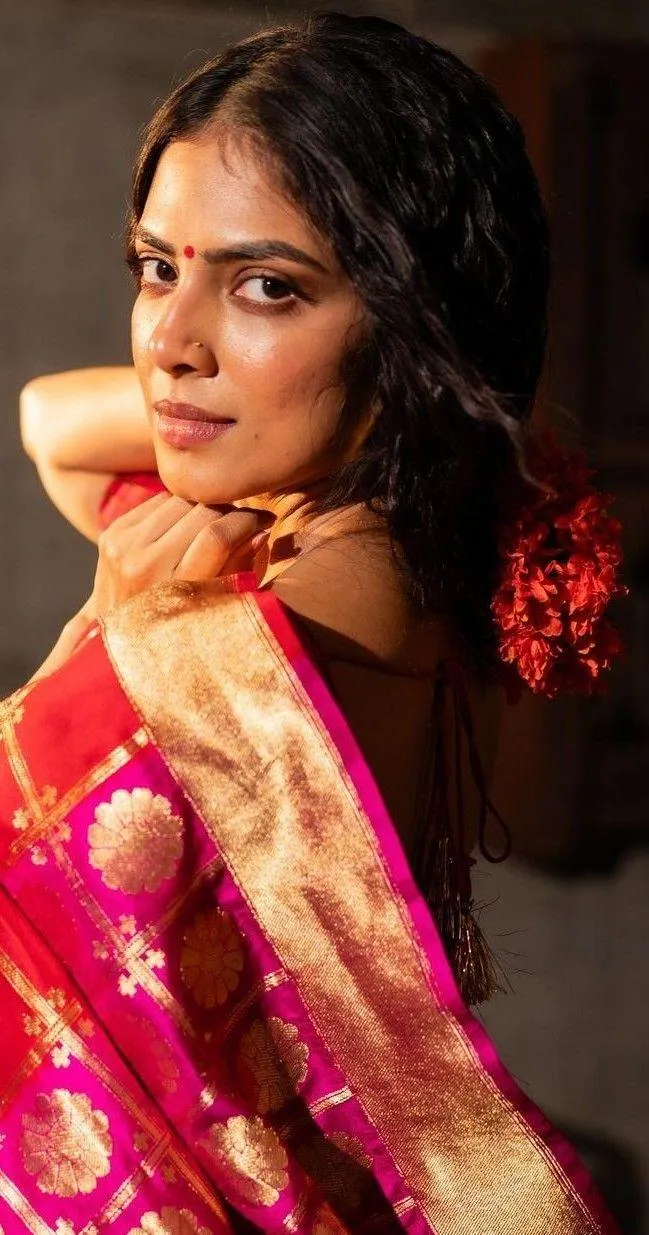 Beautiful Malavika Mohanan in Red Saree Smiling Pose Image