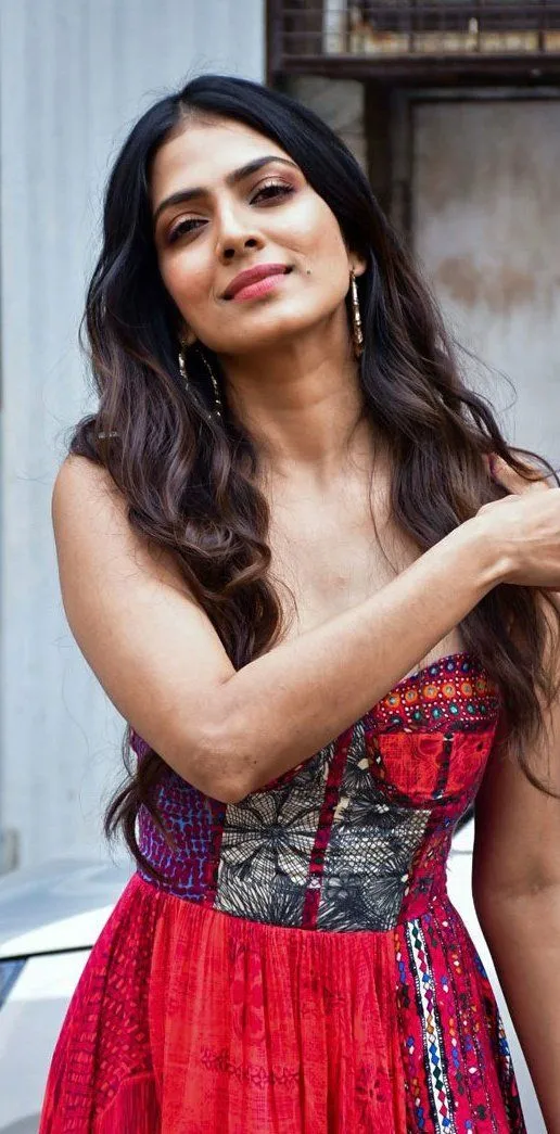 Beautiful Malavika Mohanan in Red Skirt Outdoor Posing
