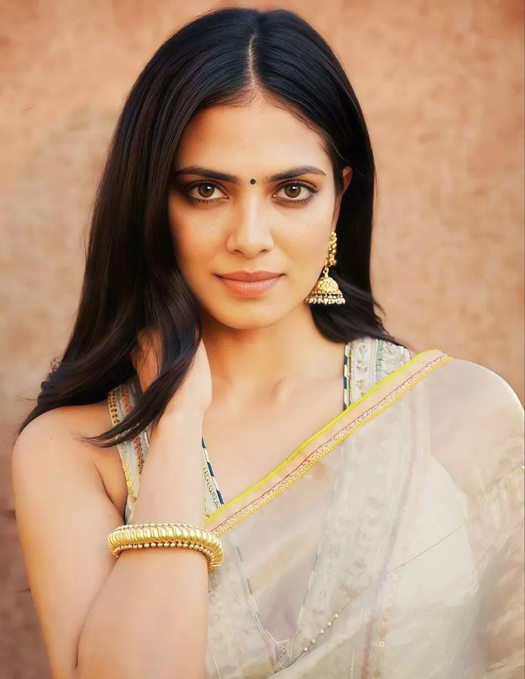 Beautiful Malavika Mohanan in White Saree Cultural Pose