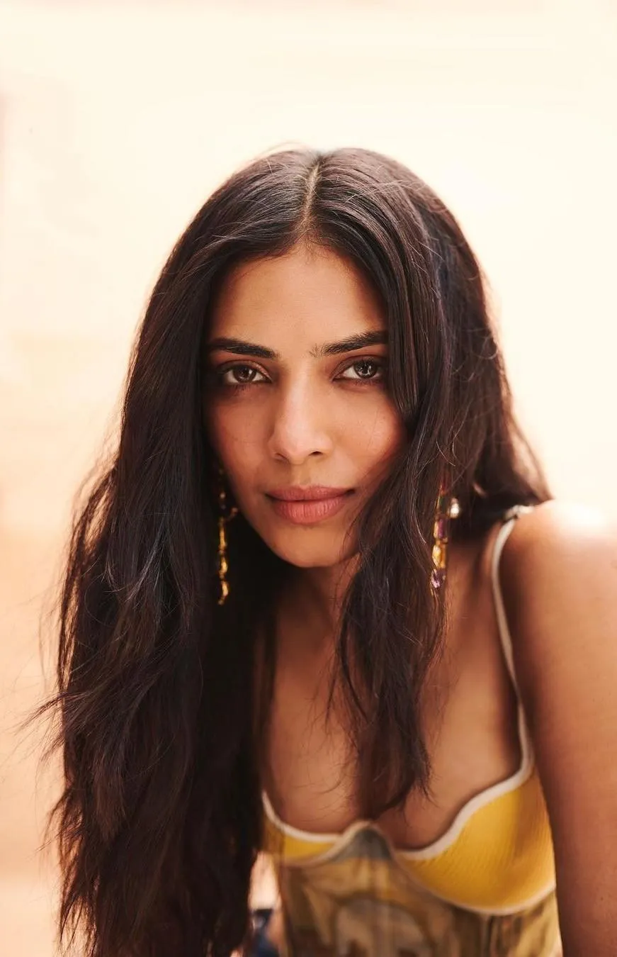 Beautiful Malavika Mohanan Posing in Yellow Dress Style