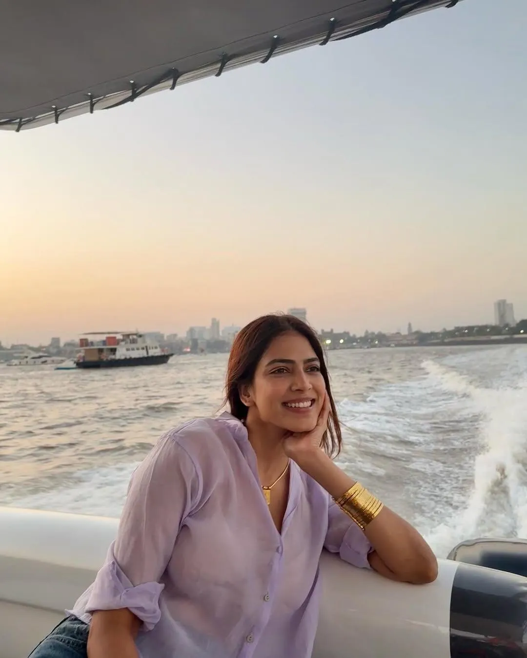 Beautiful Malavika Mohanan Relaxing Outdoors At Sunset Image