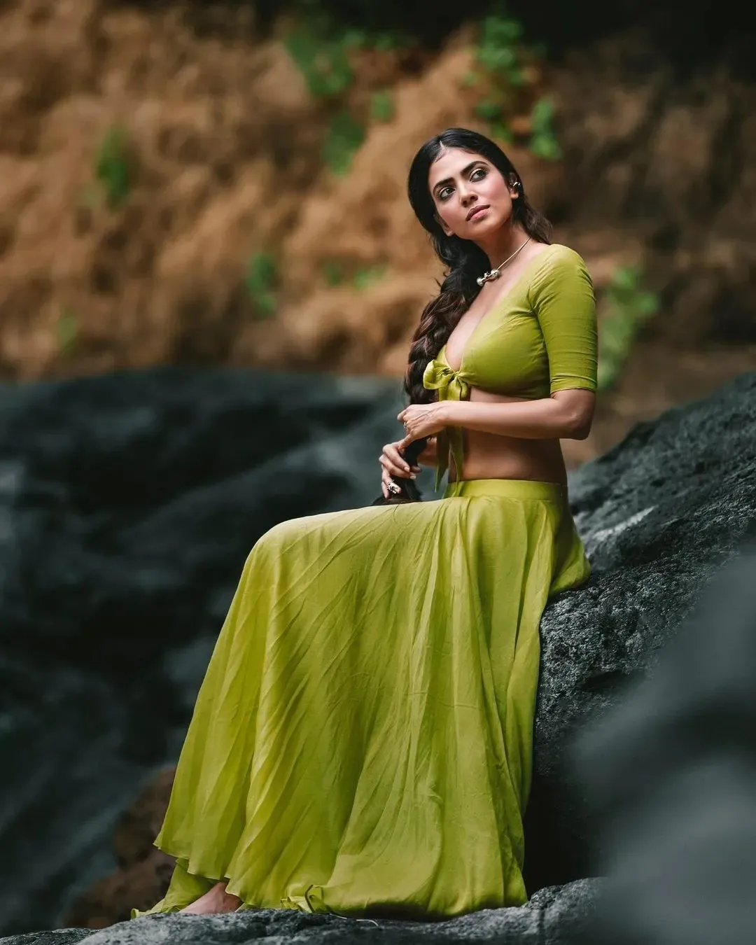 Beautiful Malavika Mohanan Sitting Outdoors in Green Dress